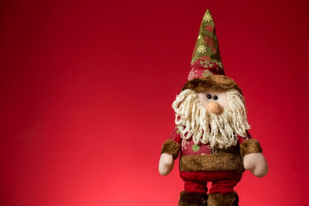Santa Claus-pop met Kerstmis rode achtergrond
