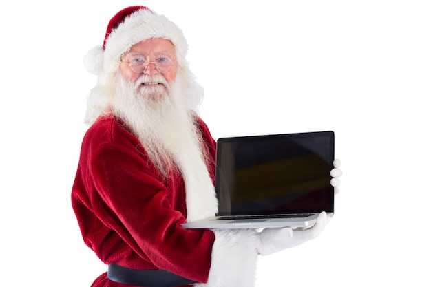 Santa Claus presents a laptop on white background