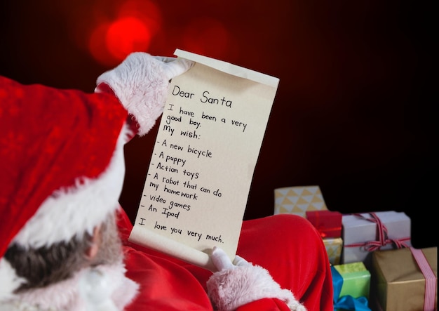 Photo santa claus reading a wish list