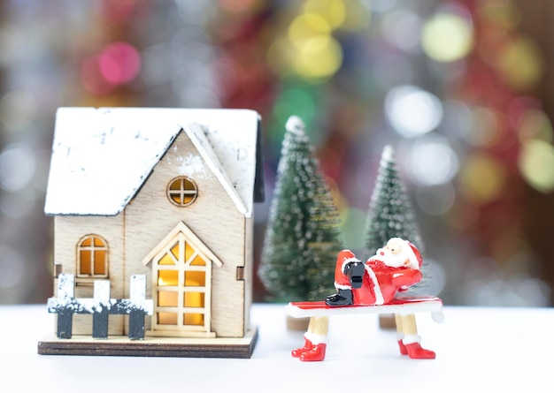 Santa Claus reclining on a red pew in front of the Christmas tree in anticipation of the funny and happiness festival