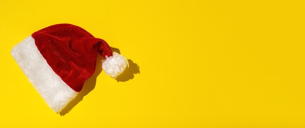 Santa Claus red hat isolated from above on colorful background