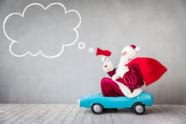 Santa Claus riding car. Christmas Xmas holiday concept