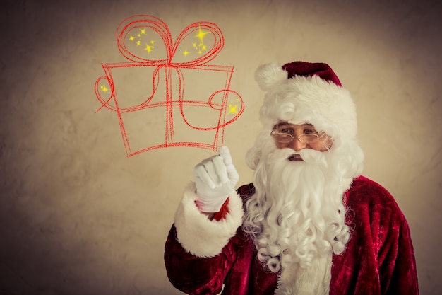 Santa Claus senior man against grunge background. Xmas holiday concept