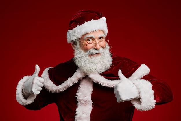 Santa Claus Showing Thumbs Up on Red