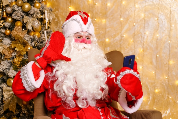 Santa claus takes selfie photos christmas night delivery of gifts enchanted childhood dreams video call