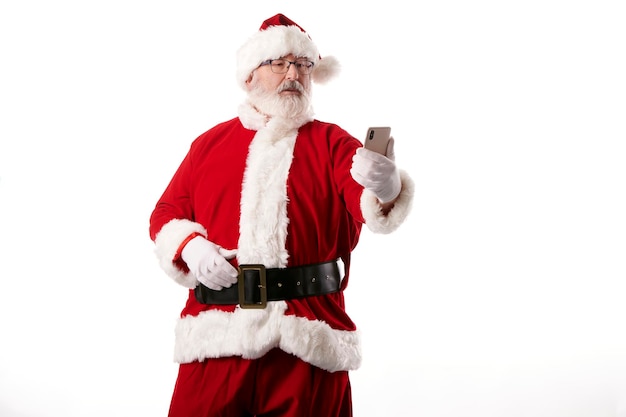 Santa Claus taking a selfie with a mobile phone on a white background