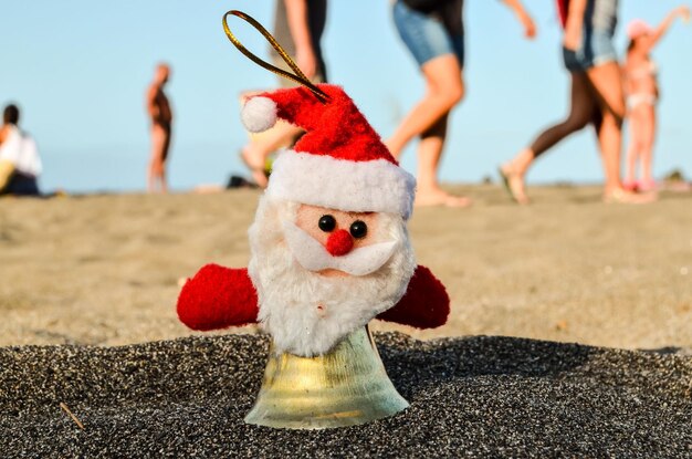 Santa Claus Toy on the Sand Beach