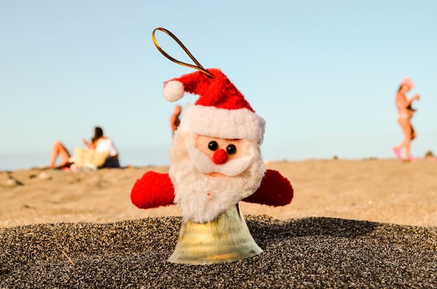 Santa Claus Toy on the Sand Beach