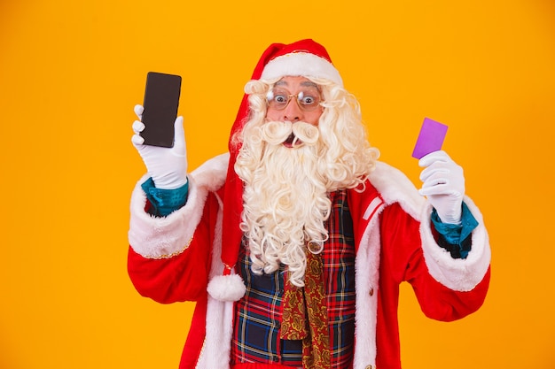 Santa Claus using credit card to pay for internet purchases