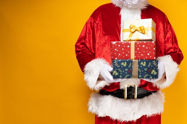 Santa claus with gift boxes in his hands