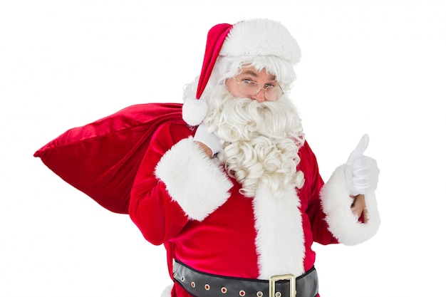 Santa claus with his sack and thumbs up