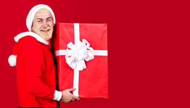 Santa claus with new year gift delivery service bearded man with big present box christmas copy