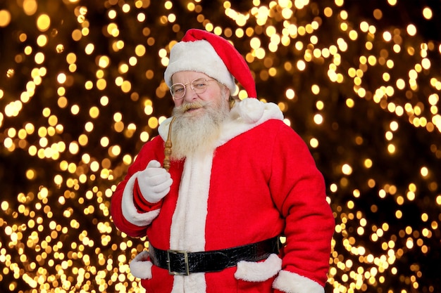 Santa Claus with pipe, portrait.