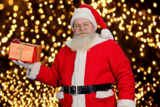 Santa Claus with red gift box.