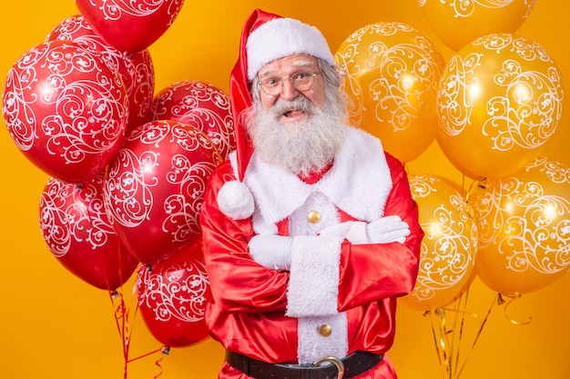 Santa Claus with some balloons in the background