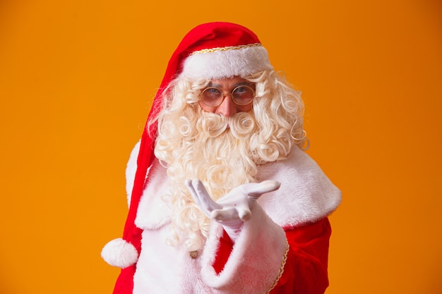 Santa Claus on yellow background.