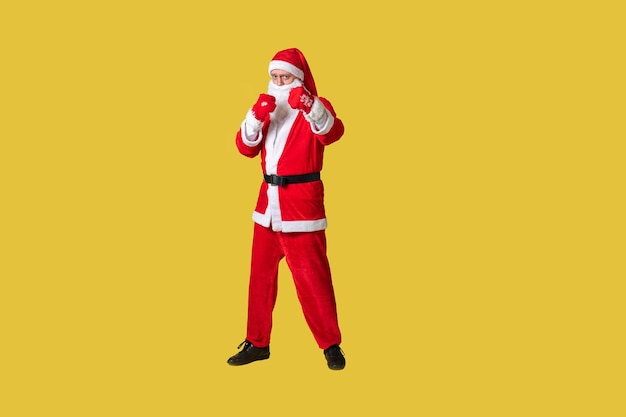 Santa claus yellow stylish fat holiday isolated senior man suit people Fashionable cheerful smile in boxing gloves