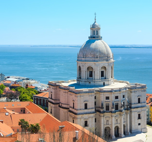 Santa Engracia Church (National Pantheon, 17th-century) and sea view from Monastery roof in Lisbon, Portugal. People unrecognizable. Two shots stitch image.