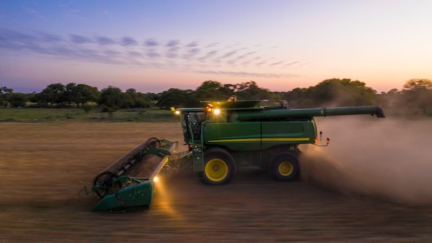 Photo santa fe, argentina, may 5, 2021: harvester from a drone. long exposure photography.