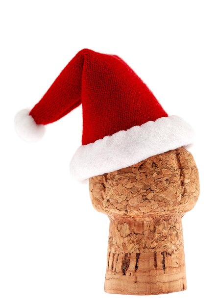 Foto cappello di babbo natale su legno su sfondo bianco