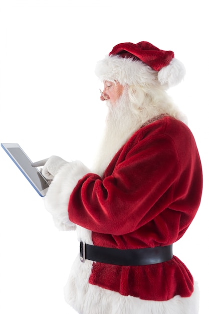 Santa maakt gebruik van een tablet-pc