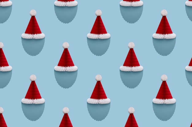 Santa paper Christmas hat with beard shaped shadow. Seamless pattern.