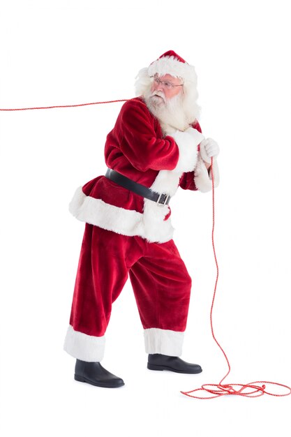 Santa pulls something with a rope