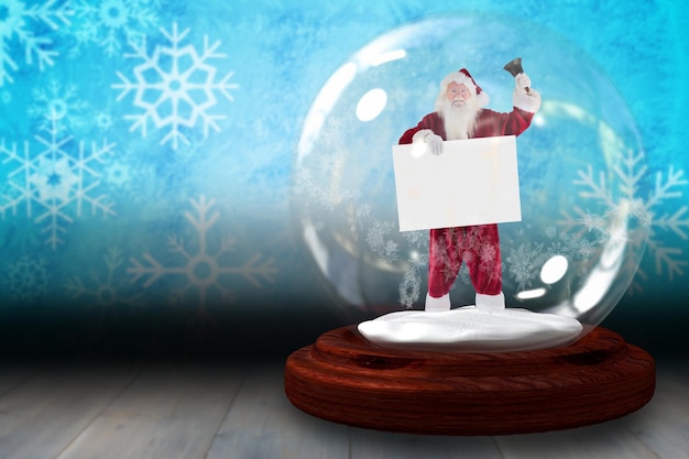 Photo santa ringing bell and holding sign in snow globe against snowflake wallpaper over floor boards