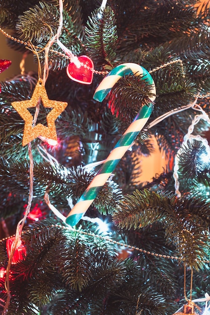 Photo santa staff lollipop on the christmas tree