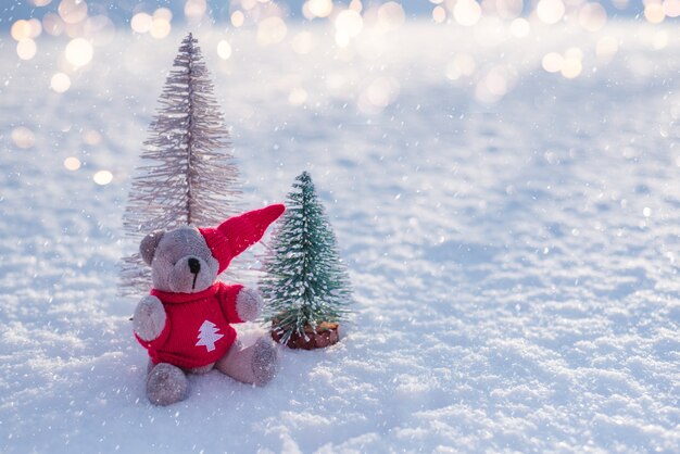 Santa teddy bear on the snow Christmas and New Year background with copy space