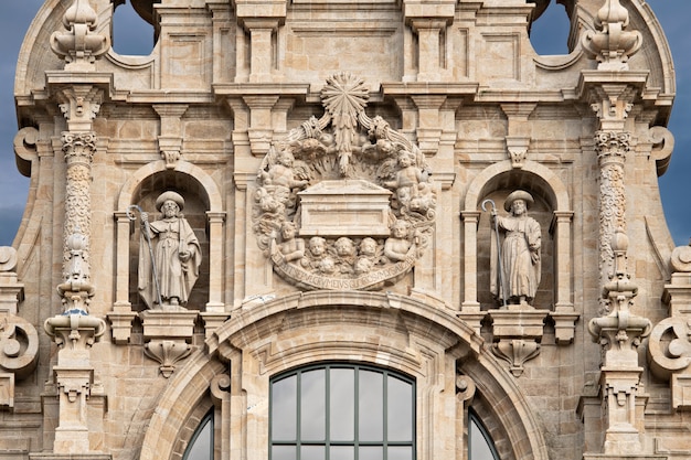 Santiago de Compostela cathedral facade detail with two sculptures of Saint James and the tomb