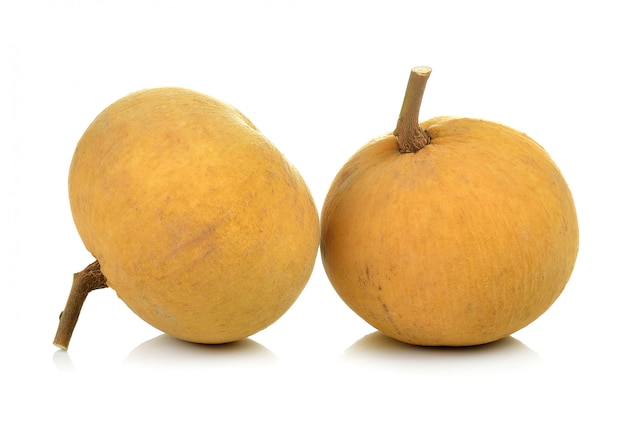 Santol fruit on white wall