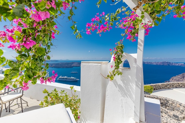 Santorini, Greece. Sunset landscape of traditional cycladic Santorini dome with flowers and stairs