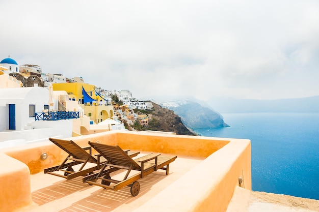 Santorini island, Greece in foggy morning. Beautiful summer landscape, sea view.