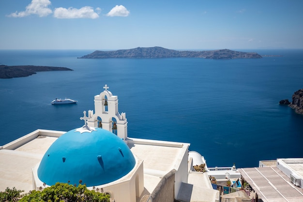 Santorini island, Greece, local church with blue white architecture and panoramic travel landscape