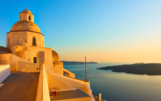 Santorini island in Greece at sunset. Landscape with Aegean Sea