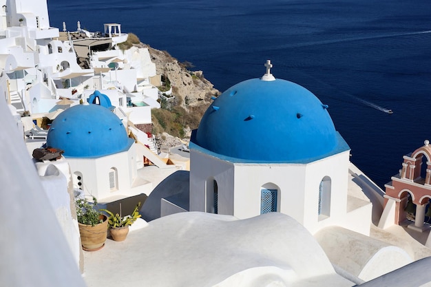 Santorini Oia Greece Traditional church with blue roof on caldera