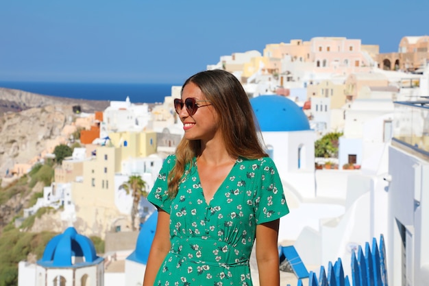 Santorini travel tourist woman on vacation in Oia in Greece