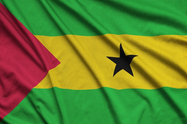 Sao Tome and Principe flag  is depicted on a sports cloth fabric with many folds. 