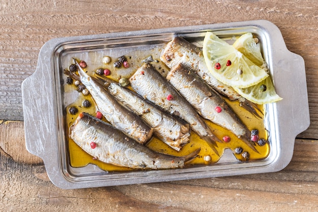 Photo sardines on the metal plate