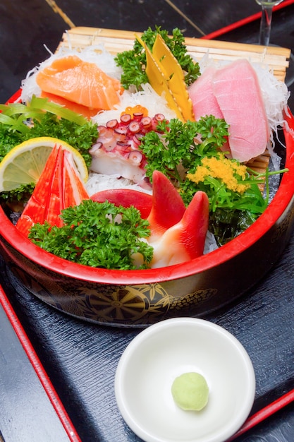 Sashimi (japanese food). Sliced raw seafood in a bowl.