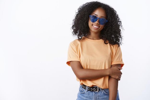 Sassy great-looking african american girl wearing sunglasses