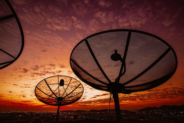 Satellite dish sky cloud sunset orange communication technology network