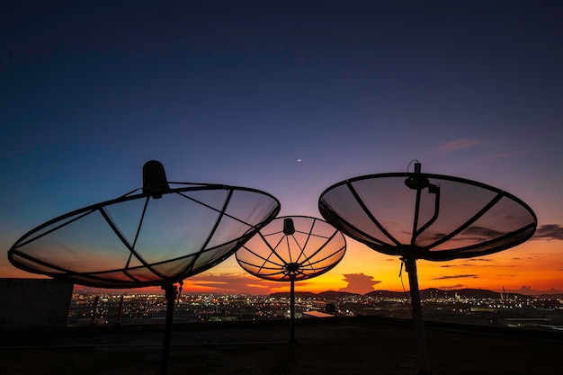 Satellite dish sky cloud sunset orange communication technology network