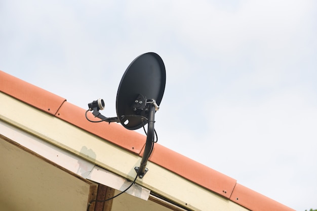 Satellite dish TV antennas on the house roof - Dish communication