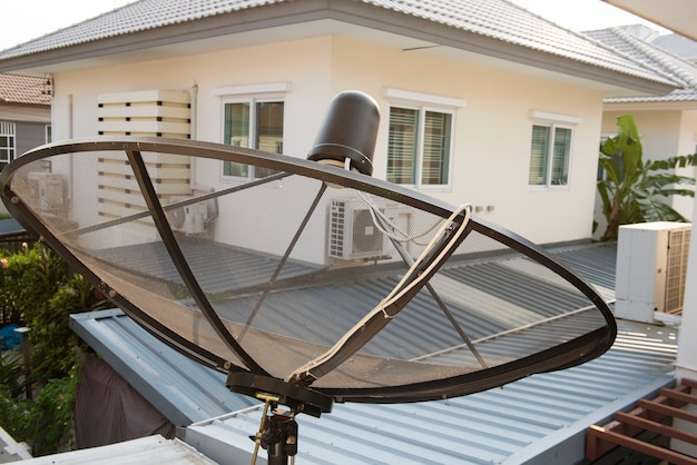 Satellite is attached to the wall of the house