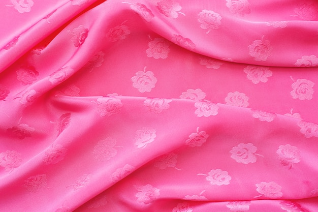 Satin fabric bright pink color is waves for the