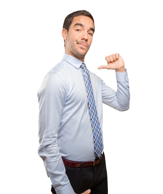 Satisfied businessman doing a victory gesture