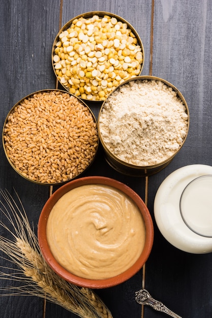 Sattu is a flour, mixture of roasted ground pulses and cereals. Traditional and nutritional food supplement from India. Served over moody background. selective focus