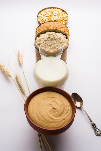 Sattu is a flour, mixture of roasted ground pulses and cereals. Traditional and nutritional food supplement from India. Served over moody background. selective focus